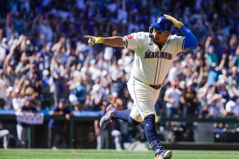 Aug 10, 2025; Seattle, Washington, USA; Seattle Mariners first baseman Josh Naylor (12) points to the Mariners dugout after hitting a solo-home run against the Tampa Bay Rays  during the seventh inning at T-Mobile Park. Mandatory Credit: Joe Nicholson-Imagn Images