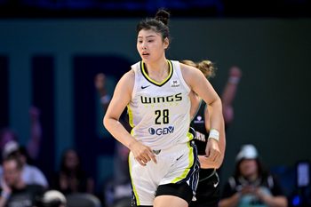 Aug 8, 2025; Arlington, Texas, USA; Dallas Wings center Li Yueru (28) in action during the game between the Dallas Wings and the New York Liberty at College Park Center. Mandatory Credit: Jerome Miron-Imagn Images