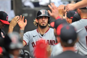 Aug 10, 2025; Chicago, Illinois, USA; Cleveland Guardians shortstop Gabriel Arias (13) celebrates with teammates in the dugout after scoring during the sixth inning against the Chicago White Sox at Rate Field. Mandatory Credit: Patrick Gorski-Imagn Images