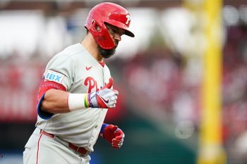Philadelphia Phillies designated hitter Kyle Schwarber (12) gestures while running the bases after hitting a home run in the eighth inning of a MLB game between the Cincinnati Reds and Philadelphia Phillies, Monday, Aug. 11, 2025, at Great American Ball Park in downtown Cincinnati. Phillies won 4-1.