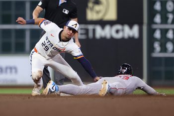 Aug 11, 2025; Houston, Texas, USA; Boston Red Sox second baseman Romy Gonzalez (23) is out on an attempted stolen base as Houston Astros secon baseman Ramon Urias (29) applies a tag during the eighth inning at Daikin Park. Mandatory Credit: Troy Taormina-Imagn Images