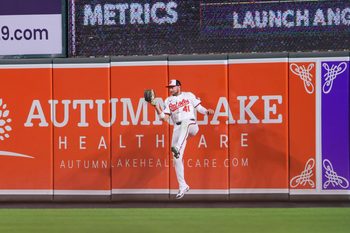 Aug 12, 2025; Baltimore, Maryland, USA; Baltimore Orioles right fielder Ryan Noda (41) makes a jumping catch for the out in the eighth inning agains the Seattle Mariners at Oriole Park at Camden Yards. Mandatory Credit: Lexi Thompson-Imagn Images