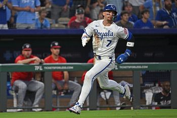 Aug 12, 2025; Kansas City, Missouri, USA;  Kansas City Royals shortstop Bobby Witt Jr. (7) scores a run in the sixth inning against the Washington Nationals at Kauffman Stadium. Mandatory Credit: Peter Aiken-Imagn Images