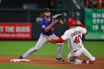 Aug 12, 2025; St. Louis, Missouri, USA;  Colorado Rockies shortstop Ezequiel Tovar (14) forces out St. Louis Cardinals first baseman Willson Contreras (40) during the fourth inning at Busch Stadium. Mandatory Credit: Jeff Curry-Imagn Images