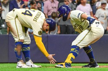 Aug 12, 2025; Milwaukee, Wisconsin, USA;  Milwaukee Brewers first baseman Andrew Vaughn (28) celebrates with  catcher William Contreras (24) after hitting a three run home run in the sixth inning at American Family Field. Mandatory Credit: Benny Sieu-Imagn Images