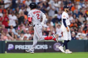 Aug 12, 2025; Houston, Texas, USA; Houston Astros third baseman Carlos Correa (1) reacts as Boston Red Sox third baseman Alex Bregman (2) rounds the bases after hitting a home run during the sixth inning at Daikin Park. Mandatory Credit: Troy Taormina-Imagn Images