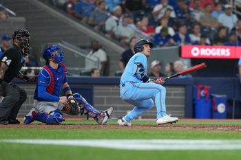 Aug 12, 2025; Toronto, Ontario, CAN; Toronto Blue Jays centre fielder Daulton Varsho (5) reacts after hitting a home run against the Chicago Cubs during the eighth inning at Rogers Centre. Mandatory Credit: Nick Turchiaro-Imagn Images