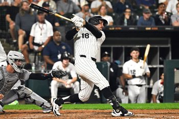 Aug 12, 2025; Chicago, Illinois, USA;  Chicago White Sox outfielder Mike Tauchman (18) hits a single against the Detroit Tigers  during the fifth inning at Rate Field. Mandatory Credit: Matt Marton-Imagn Images