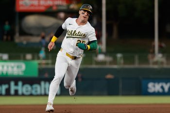 Aug 12, 2025; West Sacramento, California, USA; Athletics designated hitter Brent Rooker (25) advances to third base on a double by Tyler Soderstrom during the fourth inning against the Tampa Bay Rays at Sutter Health Park. Mandatory Credit: Sergio Estrada-Imagn Images