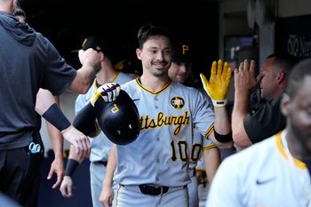 Aug 13, 2025; Milwaukee, Wisconsin, USA; Pittsburgh Pirates outfielder Bryan Reynolds (10) celebrates in the dugout after hitting a home run against the Milwaukee Brewers in the sixth inning at American Family Field. Mandatory Credit: Michael McLoone-Imagn Images