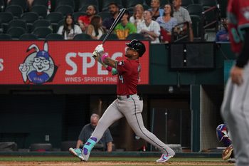 Aug 13, 2025; Arlington, Texas, USA; Arizona Diamondbacks second baseman Ketel Marte (4) follows through on a three-run home run during the ninth inning against the Texas Rangers at Globe Life Field. Mandatory Credit: Raymond Carlin III-Imagn Images