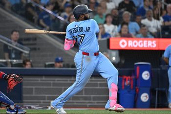 Aug 13, 2025; Toronto, Ontario, CAN;   Toronto Blue Jays first baseman Vladimir Guerrero Jr. (27) hits an RBI double against the Chicago Cubs in the sixth inning at Rogers Centre. Mandatory Credit: Dan Hamilton-Imagn Images