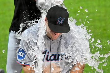 Aug 13, 2025; Cleveland, Ohio, USA; Miami Marlins center fielder Jakob Marsee (87) gets an ice water bath after a win over the Cleveland Guardians at Progressive Field. Mandatory Credit: David Richard-Imagn Images