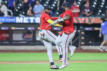 Aug 13, 2025; New York City, New York, USA;  Atlanta Braves designated hitter Marcell Ozuna (20) and center fielder Michael Harris II (23) celebrate after defeating the New York Mets 11-6 at Citi Field. Mandatory Credit: Wendell Cruz-Imagn Images