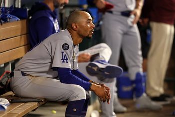 Aug 13, 2025; Anaheim, California, USA;  Los Angeles Dodgers shortstop Mookie Betts (50) looks on in the dugout during the ninth inning against the Los Angeles Angels at Angel Stadium. Mandatory Credit: Kiyoshi Mio-Imagn Images