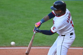 Aug 14, 2025; Cleveland, Ohio, USA; Cleveland Guardians third baseman Jose Ramirez (11) hits an RBI single in the first inning against the Miami Marlins at Progressive Field. Mandatory Credit: David Richard-Imagn Images