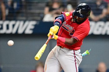 Aug 15, 2025; Cleveland, Ohio, USA; Atlanta Braves center fielder Michael Harris II (23) hits an RBI single during the ninth inning against the Cleveland Guardians at Progressive Field. Mandatory Credit: Ken Blaze-Imagn Images