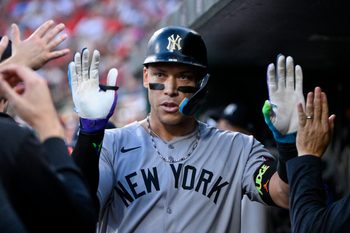 Aug 15, 2025; St. Louis, Missouri, USA;  New York Yankees designated hitter Aaron Judge (99) is congratulated by teammates after driving in a run against the St. Louis Cardinals during the first inning at Busch Stadium. Mandatory Credit: Jeff Curry-Imagn Images