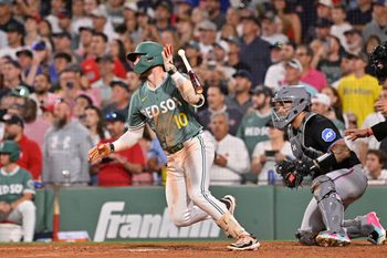 Aug 15, 2025; Boston, Massachusetts, USA; Boston Red Sox shortstop Trevor Story (10) hits a walk-off RBI against the Miami Marlins during the ninth inning at Fenway Park. Mandatory Credit: Eric Canha-Imagn Images