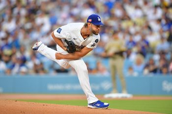 Aug 15, 2025; Los Angeles, California, USA;  Los Angeles Dodgers pitcher Clayton Kershaw (22) throws against the San Diego Padres during the first inning at Dodger Stadium. Mandatory Credit: Gary A. Vasquez-Imagn Images