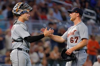 Aug 15, 2025; Minneapolis, Minnesota, USA; Detroit Tigers catcher Dillon Dingler (13) and relief pitcher Bailey Horn (67) celebrate the win over the Minnesota Twins at Target Field. Mandatory Credit: Bruce Kluckhohn-Imagn Images