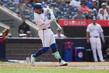 Aug 16, 2025; Toronto, Ontario, CAN; Toronto Blue Jays shortstop Bo Bichette (11) hits a single against the Texas Rangers during the the second inning at Rogers Centre. Credit: Nick Turchiaro-Imagn Images