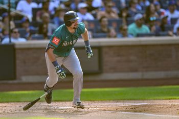 Aug 16, 2025; New York City, New York, USA; Seattle Mariners catcher Cal Raleigh (29) hits a single during the third inning against the New York Mets at Citi Field. Mandatory Credit: John Jones-Imagn Images