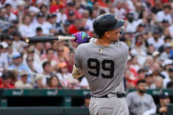 Aug 16, 2025; St. Louis, Missouri, USA;  New York Yankees designated hitter Aaron Judge (99) hits a solo home run against the St. Louis Cardinals during the third inning at Busch Stadium. Mandatory Credit: Jeff Curry-Imagn Images