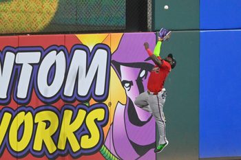 Aug 16, 2025; Cleveland, Ohio, USA; Atlanta Braves center fielder Michael Harris II (23) makes a catch at the wall in the ninth inning against the Cleveland Guardians at Progressive Field. Mandatory Credit: David Richard-Imagn Images
