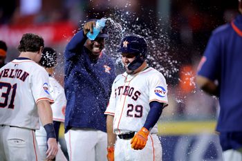 Aug 16, 2025; Houston, Texas, USA; Houston Astros second baseman Ramon Urias (29) is congratulated by teammates after hitting into a fielder's choice to score the winning run against the Baltimore Orioles during the 12th inning at Daikin Park. Mandatory Credit: Erik Williams-Imagn Images