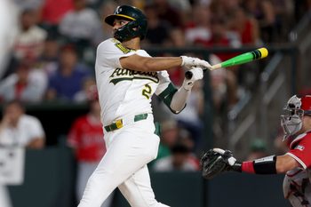 Aug 16, 2025; West Sacramento, California, USA; Athletics shortstop Darell Hernaiz (2) hits a two-run single against the Los Angeles Angels during the third inning at Sutter Health Park. Mandatory Credit: Dennis Lee-Imagn Images
