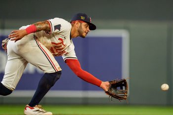 Aug 16, 2025; Minneapolis, Minnesota, USA; Minnesota Twins second baseman Austin Martin (16) fields a throw to second base during the warmups at the top of the eighth inning against the Detroit Tigers at Target Field. Mandatory Credit: Matt Blewett-Imagn Images