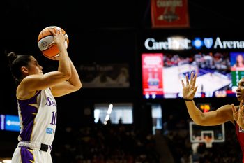 Aug 17, 2025; Washington, District of Columbia, USA; Los Angeles Sparks guard Kelsey Plum (10) shoots the ball as Washington Mystics forward Kiki Iriafen (44) defends in the first half at CareFirst Arena. Mandatory Credit: Geoff Burke-Imagn Images