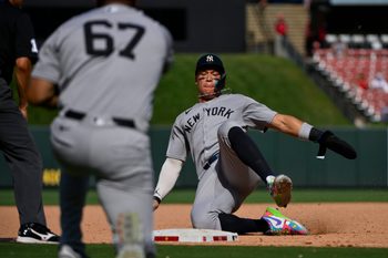 Aug 17, 2025; St. Louis, Missouri, USA;  New York Yankees designated hitter Aaron Judge (99) slides in at third base against the St. Louis Cardinals during the ninth inning at Busch Stadium. Mandatory Credit: Jeff Curry-Imagn Images