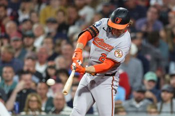 Aug 18, 2025; Boston, Massachusetts, USA; Baltimore Orioles shortstop Gunnar Henderson (2) hits an RBI triple during the seventh inning against the Boston Red Sox at Fenway Park. Mandatory Credit: Paul Rutherford-Imagn Images