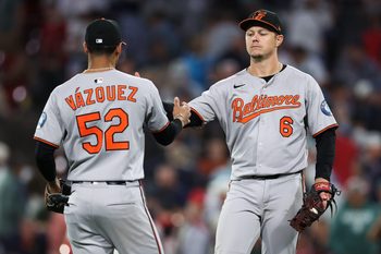 Aug 18, 2025; Boston, Massachusetts, USA; Baltimore Orioles first baseman Ryan Mountcastle (6) and Baltimore Orioles shortstop Luis Vazquez (52) celebrate after defeating the Boston Red Sox at Fenway Park. Mandatory Credit: Paul Rutherford-Imagn Images