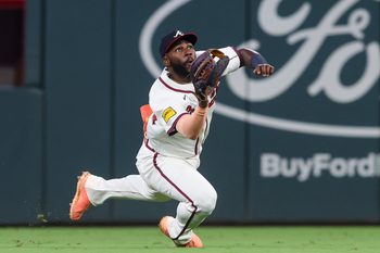 Aug 19, 2025; Atlanta, Georgia, USA; Atlanta Braves center fielder Michael Harris II (23) makes a diving catch against the Chicago White Sox in the ninth inning at Truist Park. Mandatory Credit: Brett Davis-Imagn Images