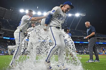 Aug 19, 2025; Kansas City, Missouri, USA;  Kansas City Royals teammates ice down shortstop Bobby Witt Jr. (7) after beating the Texas Rangers at Kauffman Stadium. Mandatory Credit: Peter Aiken-Imagn Images