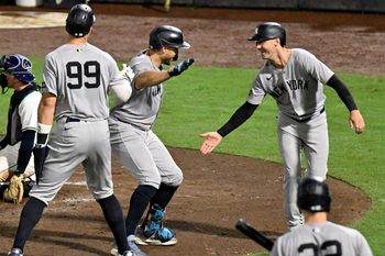 Aug 19, 2025; St. Petersburg, Florida, USA; New York Yankees right fielder fielder Giancarlo Stanton (27) celebrates with left fielder Cody Bellinger (35) and designated hitter Aaron Judge (99) after hitting a three run home run in the fourth inning against the Tampa Bay Rays at George M. Steinbrenner Field. Mandatory Credit: Jonathan Dyer-Imagn Images