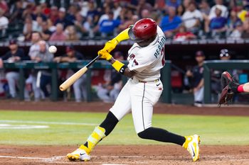 Aug 19, 2025; Phoenix, Arizona, USA; Arizona Diamondbacks infielder Geraldo Perdomo hits an RBI single in the fifth inning against the Cleveland Guardians at Chase Field. Mandatory Credit: Mark J. Rebilas-Imagn Images