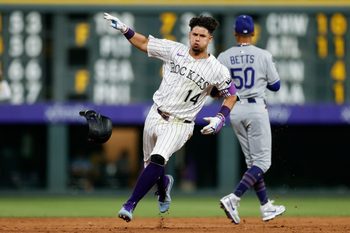 Aug 19, 2025; Denver, Colorado, USA; Colorado Rockies shortstop Ezequiel Tovar (14) rounds the bases on a triple in the eighth inning aLos Angeles Dodgers at Coors Field. Mandatory Credit: Isaiah J. Downing-Imagn Images