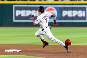 Aug 19, 2025; Phoenix, Arizona, USA; Arizona Diamondbacks outfielder Corbin Carroll loses his helmet as he runs the bases after hitting a triple in the fourth inning against the Cleveland Guardians at Chase Field. Mandatory Credit: Mark J. Rebilas-Imagn Images