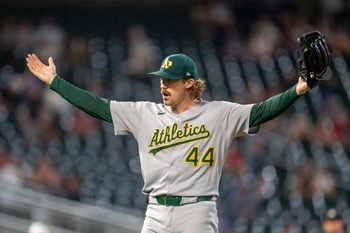 Aug 20, 2025; Minneapolis, Minnesota, USA; Athletics pitcher Tyler Ferguson (44) celebrates after defeating the Minnesota Twins at Target Field. Mandatory Credit: Jesse Johnson-Imagn Images