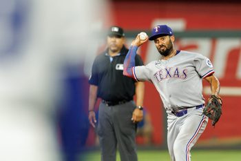 Aug 20, 2025; Kansas City, Missouri, USA; Texas Rangers second base Marcus Semien (2) throws to first base during the ninth inning against the Kansas City Royals at Kauffman Stadium. Mandatory Credit: William Purnell-Imagn Images
