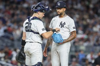 Aug 21, 2025; Bronx, New York, USA;  New York Yankees starting pitcher Luis Gil (81) talks with catcher Ben Rice (22) after loading the bases in the fifth inning against the Boston Red Sox at Yankee Stadium. Mandatory Credit: Wendell Cruz-Imagn Images