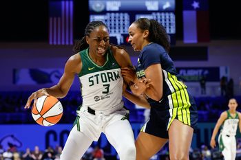 Aug 22, 2025; Arlington, Texas, USA;  Seattle Storm forward Nneka Ogwumike (3) contols the ball as Dallas Wings guard Haley Jones (30) defends during the first half at College Park Center. Mandatory Credit: Chris Jones-Imagn Images