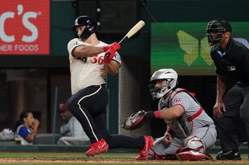 Aug 22, 2025; Arlington, Texas, USA; Texas Rangers left fielder Wyatt Langford (36) hits a double during the ninth inning against the Cleveland Guardians at Globe Life Field. Mandatory Credit: Raymond Carlin III-Imagn Images