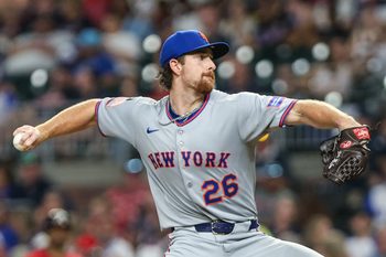 Aug 22, 2025; Cumberland, Georgia, USA; New York Mets pitcher Nolan McLean (26) pitches the ball against the Atlanta Braves during the sixth inning at Truist Park. Mandatory Credit: Jordan Godfree-Imagn Images
