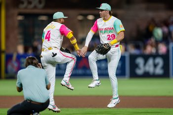 Aug 22, 2025; San Diego, California, USA; San Diego Padres first baseman Luis Arraez (4) celebrates with center fielder Bryce Johnson (29) after defeating the the Los Angeles Dodgers at Petco Park. Mandatory Credit: David Frerker-Imagn Images