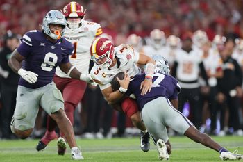 Aug 23, 2025; Dublin, IRELAND; Iowa State quarterback Rocco Becht is tackled by VJ Payne of Kansas State during the Aer Lingus Classic between Iowa State and Kansas State at Aviva Stadium. Mandatory Credit: Laszlo Geczo/INPHO via Imagn Images